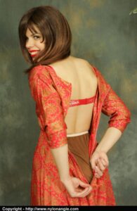 Cute girl in a slip and girdle