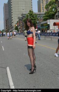 Angie struts outside in nothing but lingerie