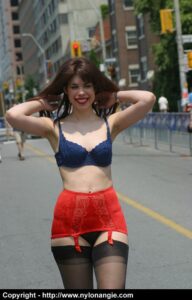 Angie struts outside in nothing but lingerie