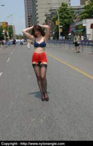 Angie struts outside in nothing but lingerie