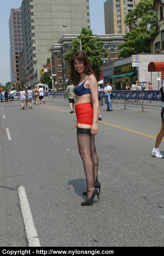 Angie struts outside in nothing but lingerie